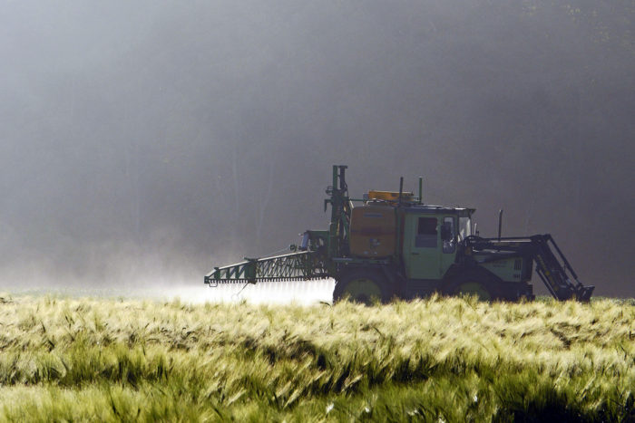 Farm tractory spraying crops. (Photo credit: hpgruesen)