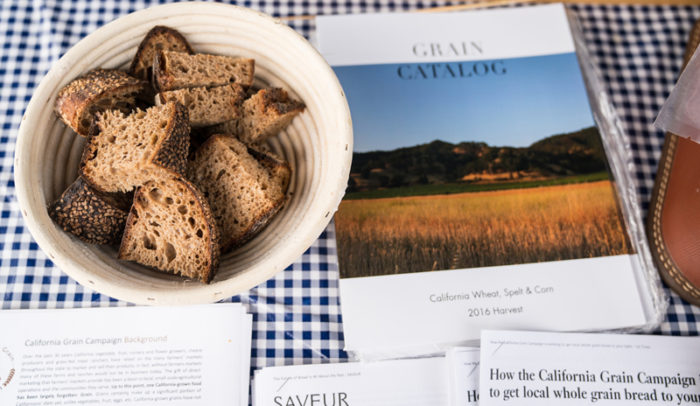 The California Grain Campaign catalogue with Mai Nguyen's grains in bread. (Photo by Jessica Blackstock)