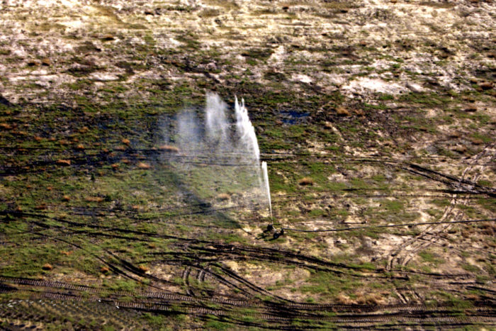 A North Carolina hog CAFO spraying hog waste on a nearby field. (Photo courtesy of Waterkeeper Alliance)