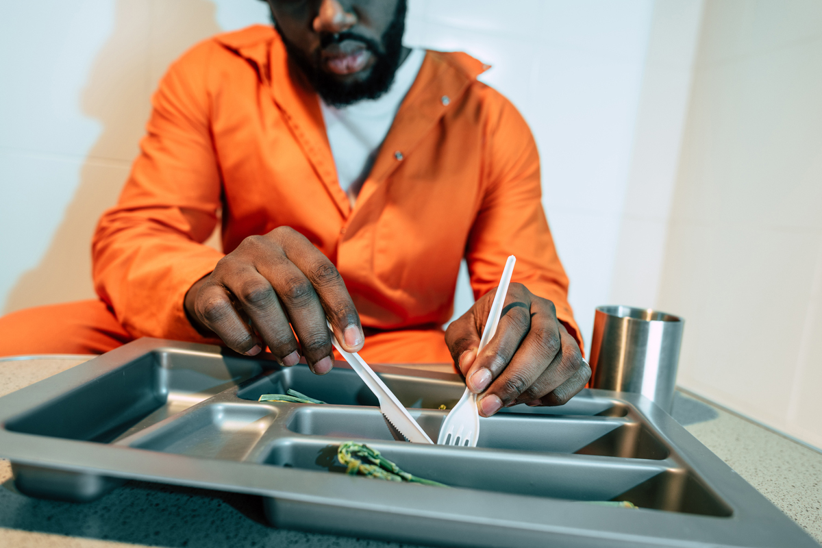 incarcerated person eating prison food