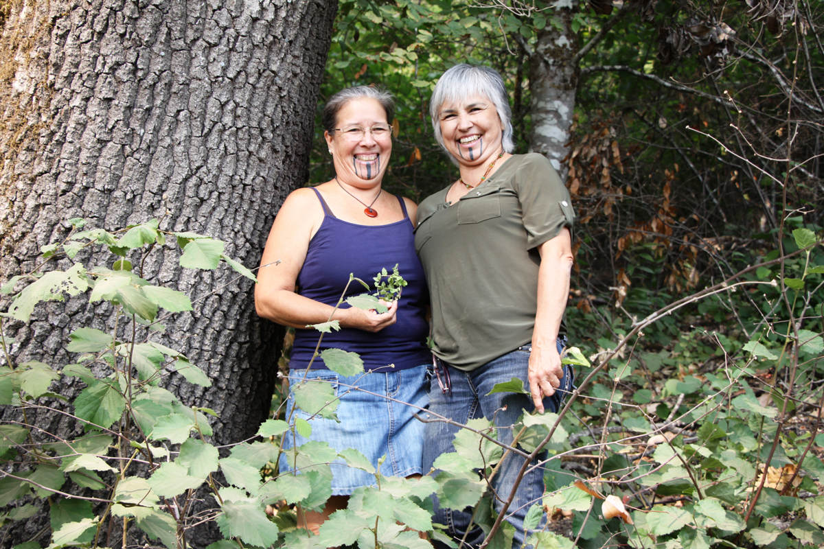 Elizabeth Azzuz and Margo Robbins, leaders of the Cultural Fire Management Council, have been helping Yurok Tribal members burn their land to improve the growth of basket materials and other traditional plants.