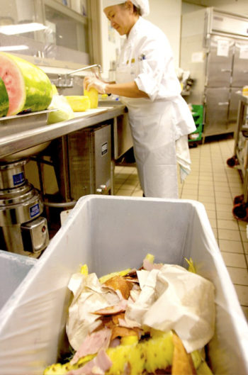 Separating organic waste in a commercial kitchen. (Photo CC-licensed by the Minnesota Pollution Control Agency)