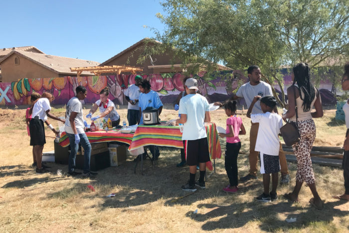 Serving food to visitors and volunteers at the TigerMountain farm.