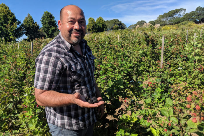 Latinx farmowner Javier Zamora on his farm