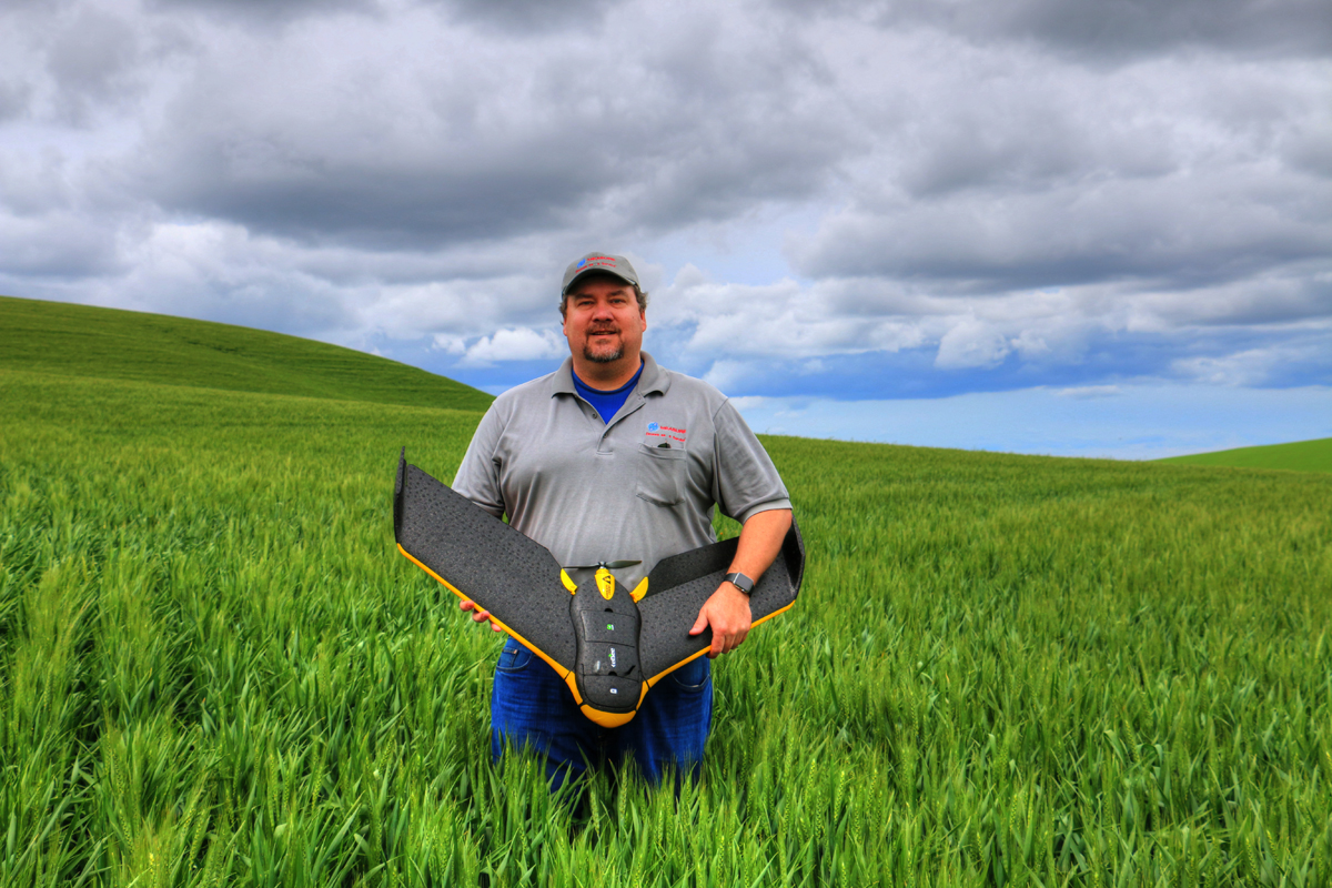 Robert Blair holding an eBee Ag drone. (Photo courtesy of Robert Blair)