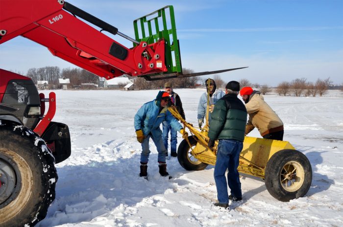 Frost seeding contour prairie strips on top of snow on Margaret and Larry Stone's farm near Traer, Iowa. January 2016.