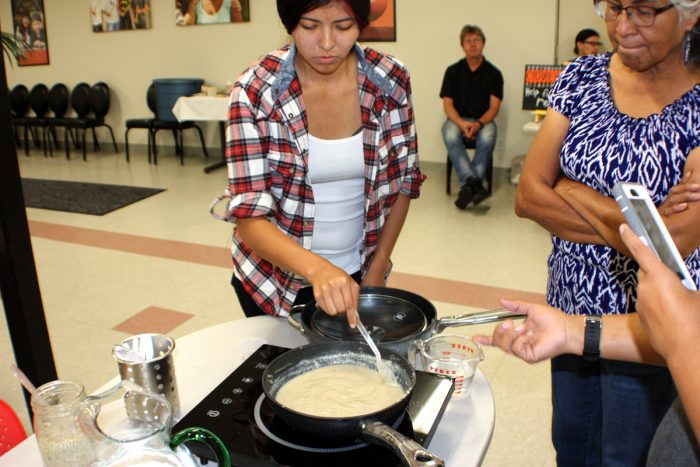 Cultural educators demonstrate ways of preparing acorn mush.