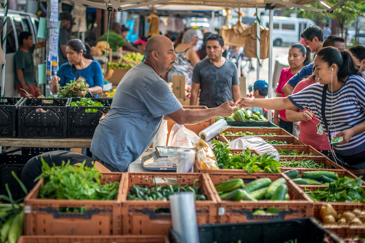 Martin Rodriguez sells his vegetables at the Corona Farmers Market in Queens, New York, one of the most dynamic and diverse farmers markets in the city and is steps off the subway and mass transit system for the city. (USDA Photo by Preston Keres)