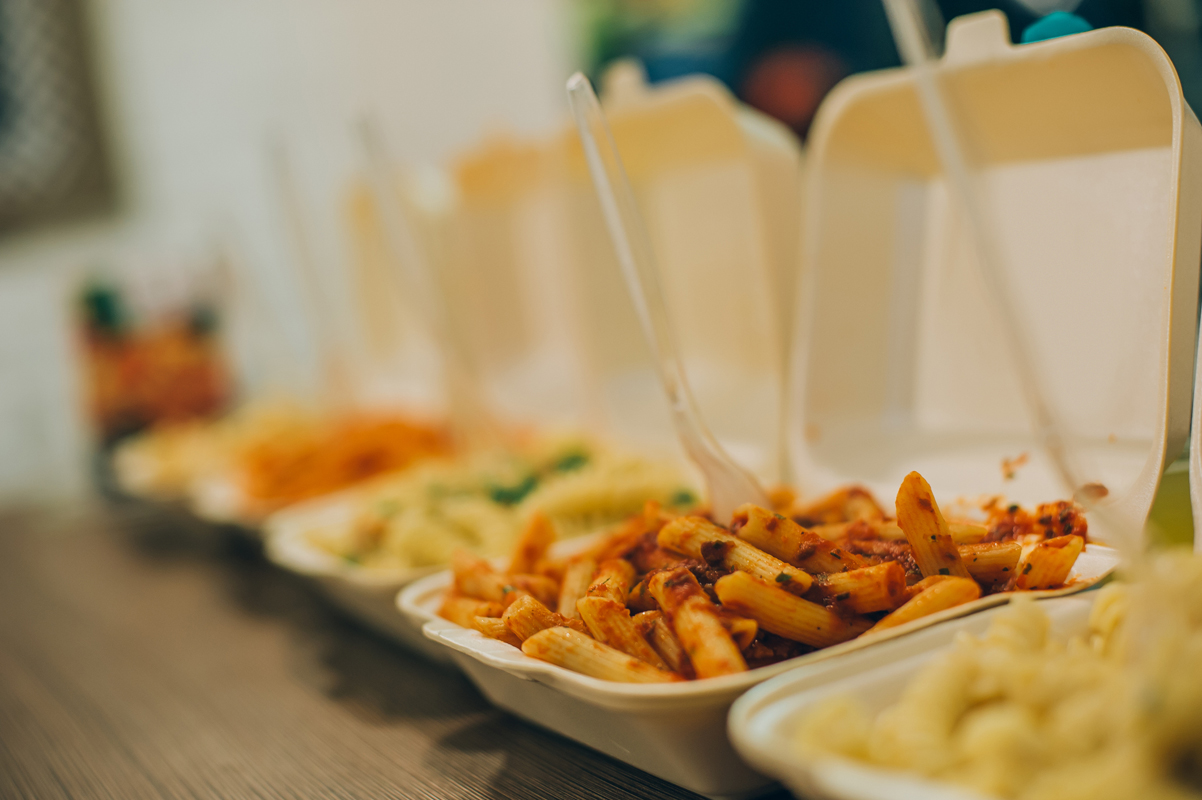 a row of compostable food packaging containers