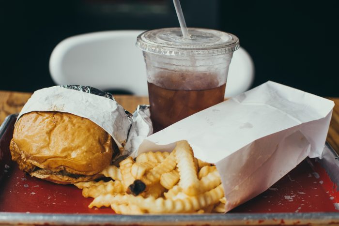 Burger and fries photo by Christopher Williams on Unsplash