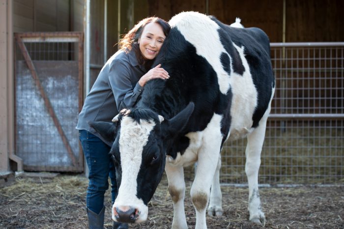 Miyoko Schinner with a cow.