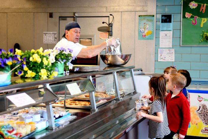 Students at Hamburg CSD in upstate New York speak with a lunchroom worker. (Photo credit: Nancy J. Parisi for AFT)