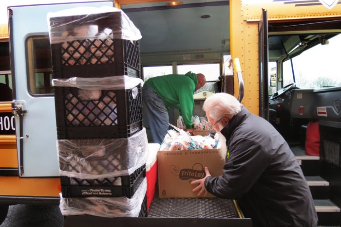 Volunteers loading up a school bus for rural food deliveries. Photo courtesy of Bullitt County Public Schools.