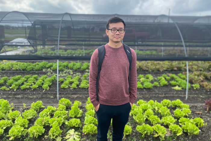 Khai Nguyen stands in the fields at Veggi Co-op farm in New Orleans. c