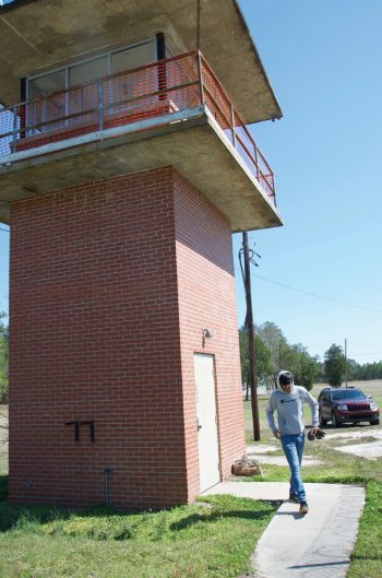 Robin Patel exits the former guard tower the youth plan to flip into a community climbing wall.