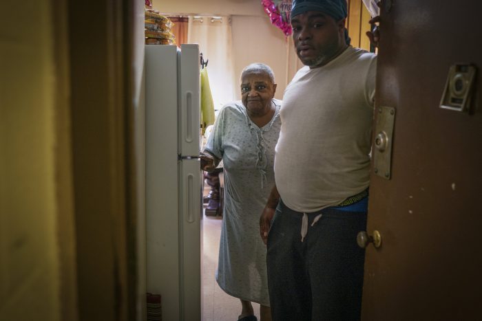 A son with his mother who received emergency meals in the South Bronx.