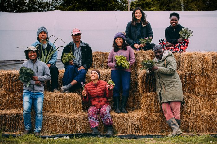 A group photo from New Roots for Refugees. (Photo credit: IM Photography)