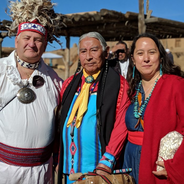 Rowen White stands with two tribal elders. (Photo courtesy of Rowen White)