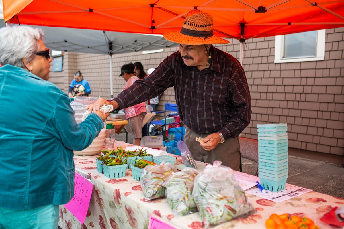 Joel Pelayo sells chiles at the Mercado del Valley. (Photo credit: Gorge Grown)