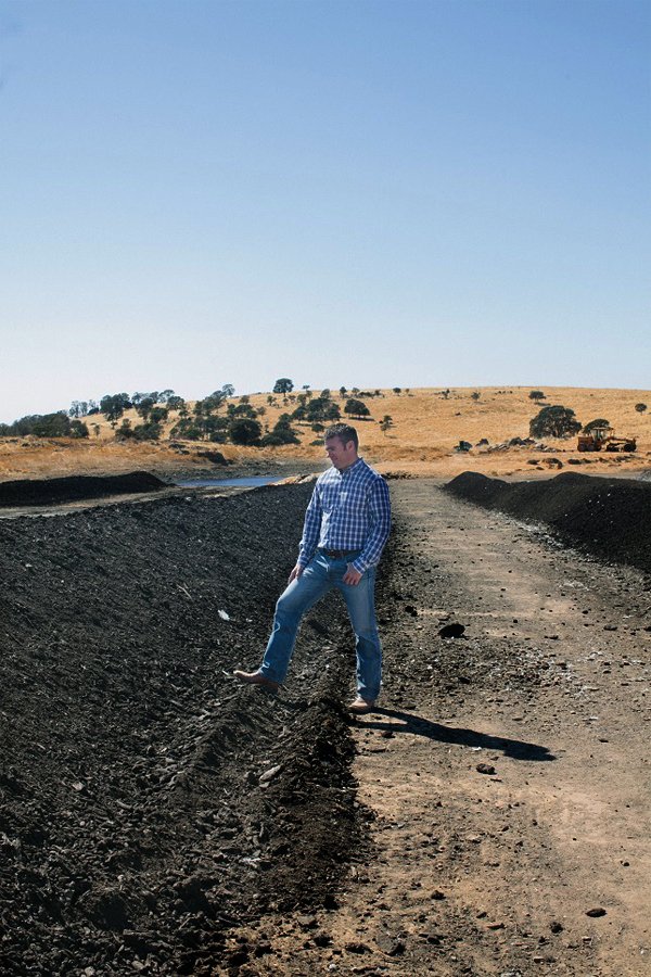 Jason Diestel stands next to some of the compost their turkeys have helped produce. (Photo courtesy of Diestel Family Farms)