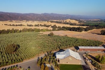 An overhead view of the Yocha Dehe Wintu Nation's farmland, including the Séka Hills oil processing mill.