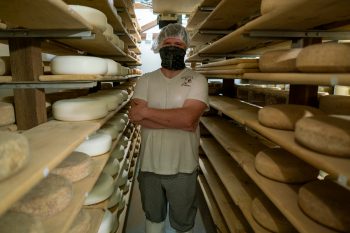 Pete Messmer in Lively Run’s aged cheese room.