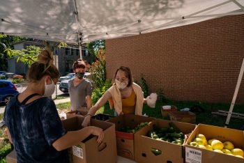 A college student receives fresh produce at PressBay.