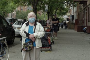 Seniors and others wait in line at a WCK distribution in East Harlem.