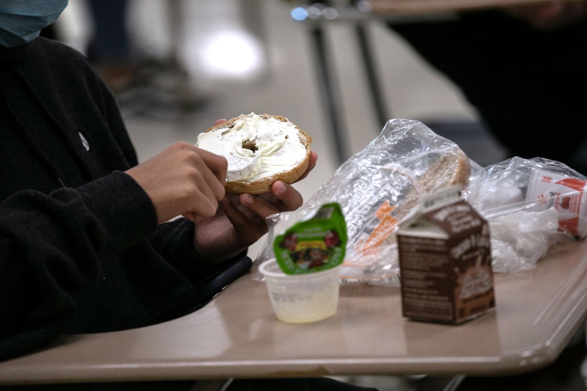 A student prepares lunch in the cafeteria during the first day of school at Stamford High School on September 08, 2020 in Stamford, Connecticut. (Photo by John Moore/Getty Images)