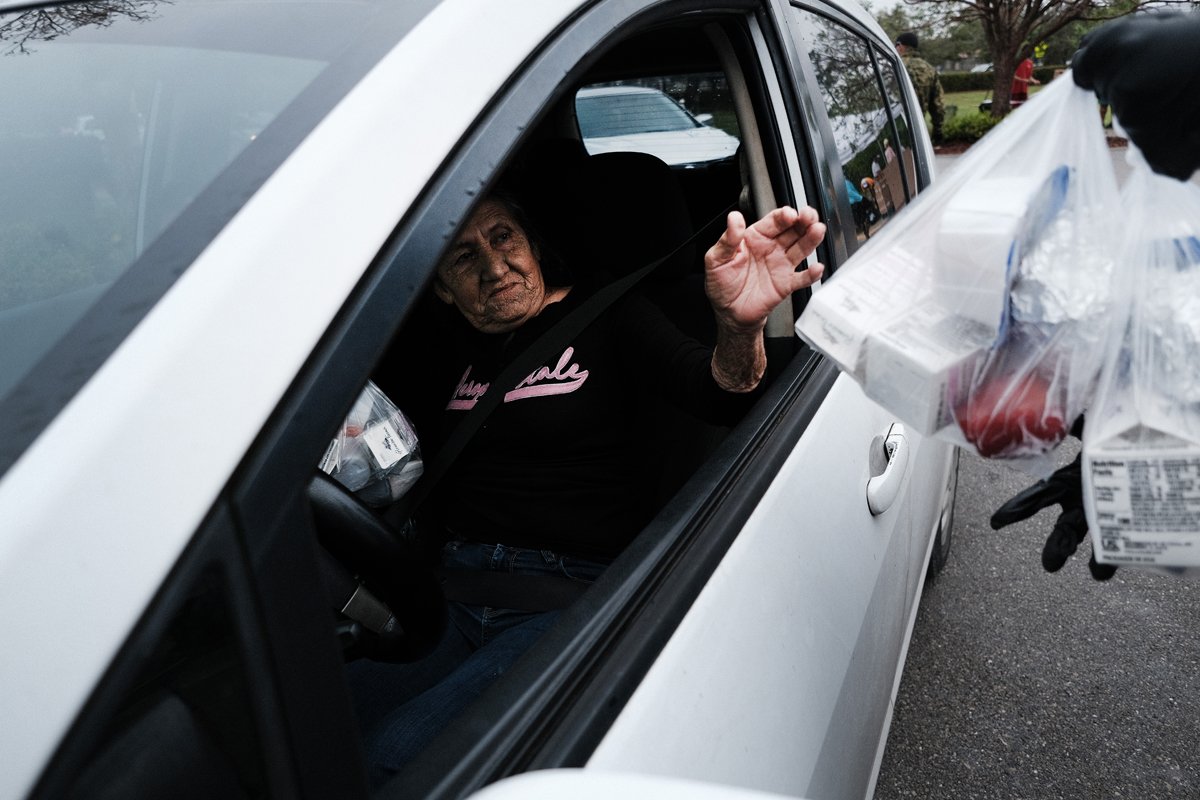 Food is distributed during a mobile food pantry in the agricultural community of Immokalee on February 16, 2021 in Immokalee, Florida.