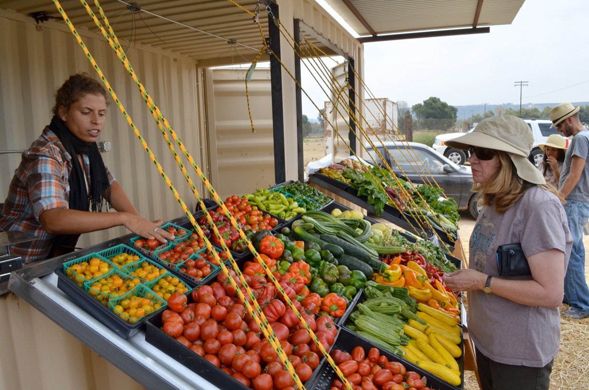 A farmstand selling community-grown food. (Photo CC-licensed by Suzie's Farm)