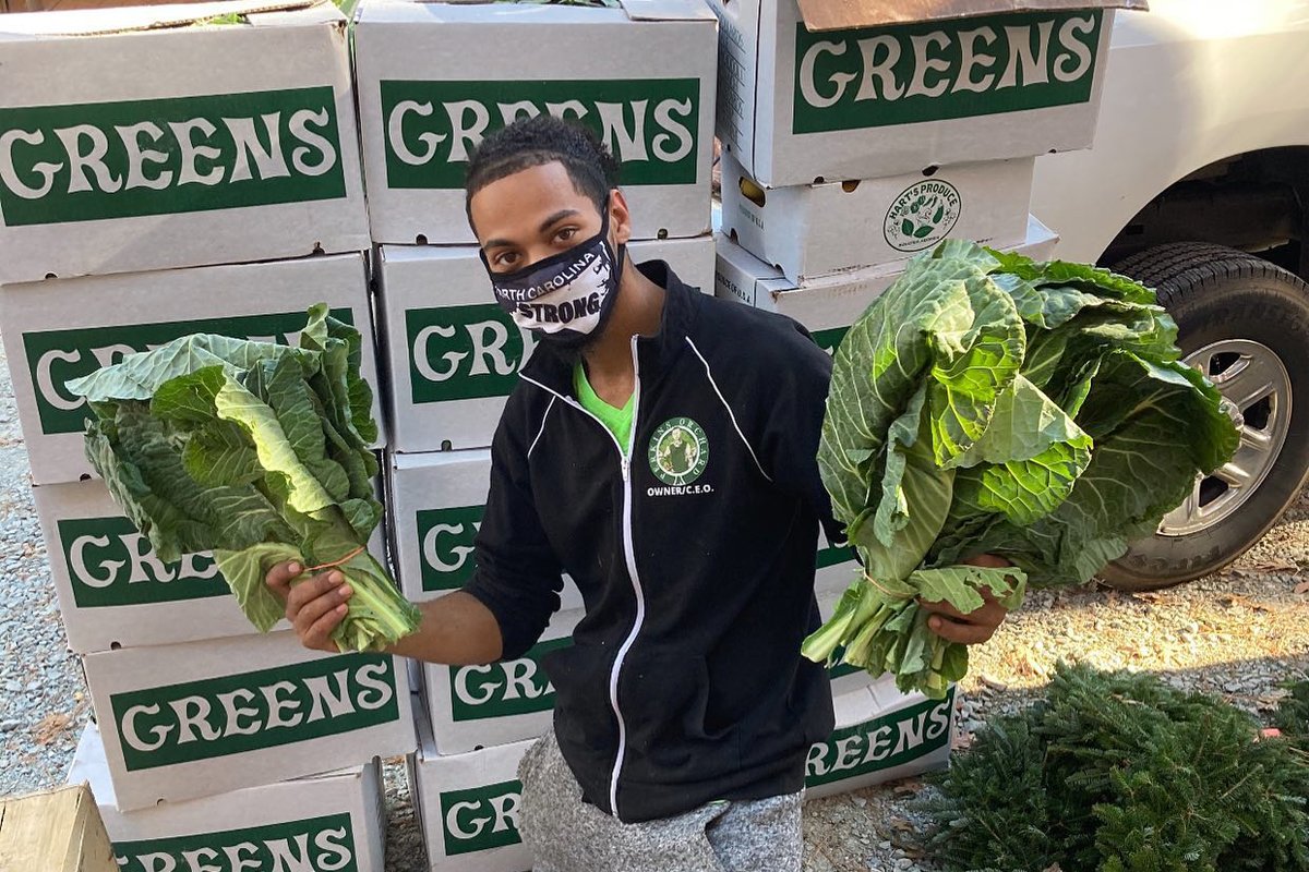 Donovan Watson holds collard greens at Perkins Orchard. Perkins Orchard. (Photo courtesy of Donovan Watson)