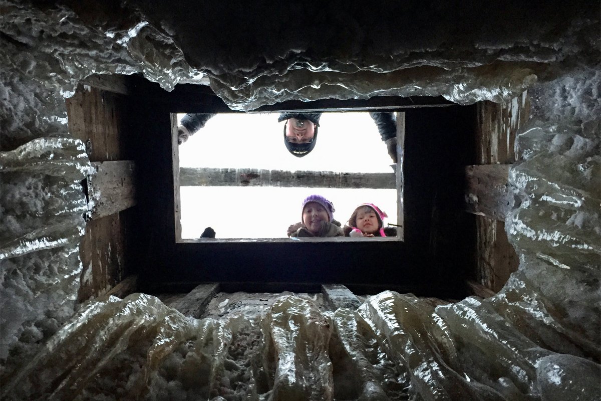 looking up from an iñupiat ice cellar. Photo courtesy of Qaiyaan Harcharek)