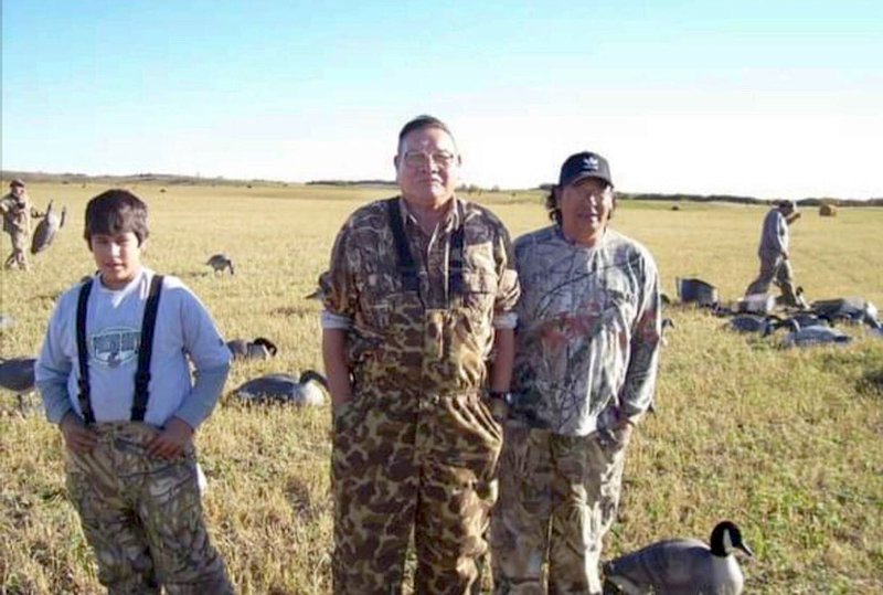 Ruth Hopkins' father, hunting with his nephews. (Photo courtesy of Ruth Hopkins)