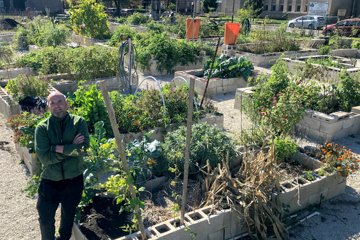 Seamus Ford stands at the north corner of the garden after giving a tour in October 2021. (Photo by Jordyn Harrison)