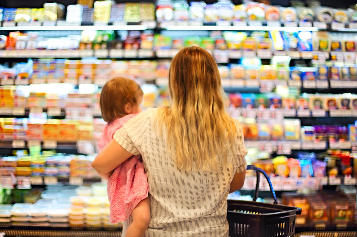 Mother and baby grocery shopping.