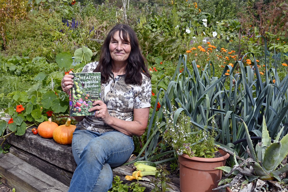 Sally Morgan with her book, "The Healthy Vegetable Garden."