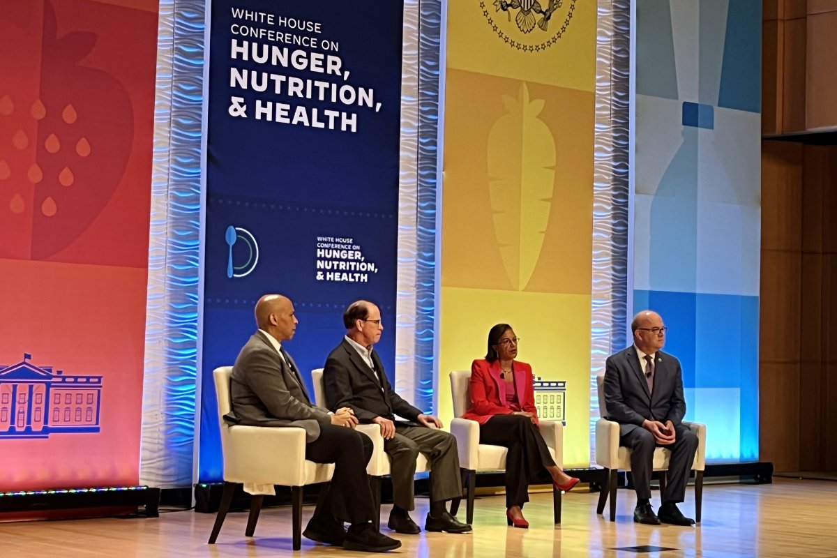 On stage at the White House Conference on Hunger, Nutrition, and Health, from left: Senator Cory Booker, Senator Mike Braun, White House Domestic Policy Advisor Susan Rice, and Representative Jim McGovern. (Photo credit: Lisa Held)