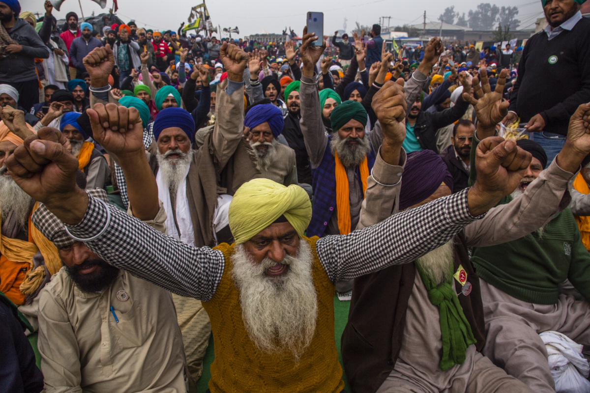 Indian farmers shout anti-government slogans during a protest against new farm laws in December 2020. (Photo by Yawar Nazir/Getty Images)