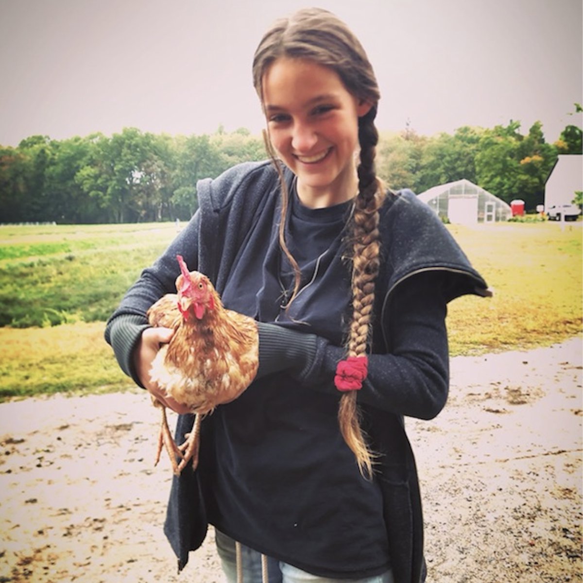 Young climate activist Ollie Perrault holding a chicken. (Photo courtesy of Ollie Perrault)