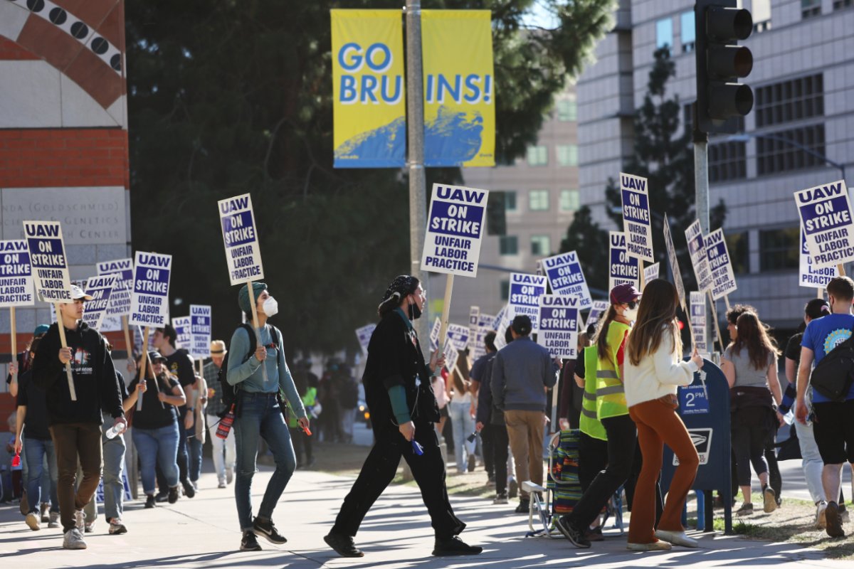 LOS ANGELES, CALIFORNIA - NOVEMBER 15: Union academic workers and supporters march and picket at the UCLA campus amid a statewide strike by nearly 48,000 University of California unionized workers on November 15, 2022 in Los Angeles, California. The strikers are calling for improved wages and benefits at the 10 UC public university campuses across California. (Photo by Mario Tama/Getty Images)