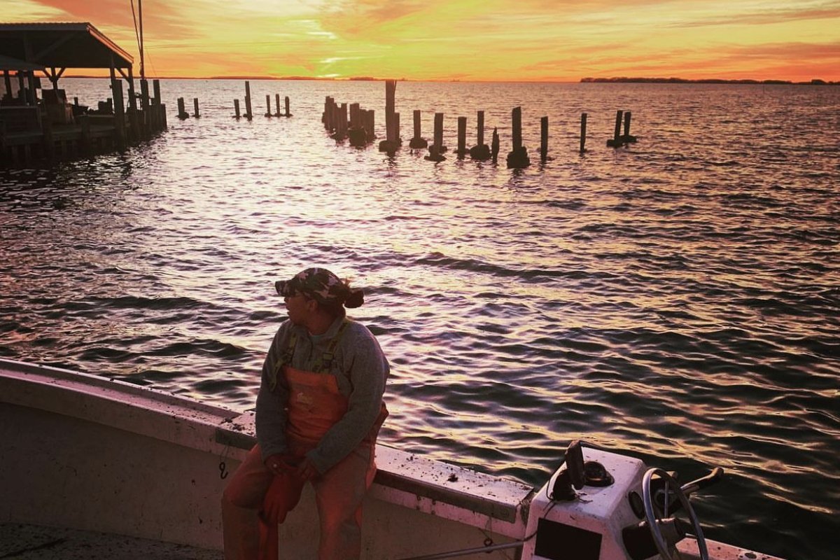 Imani Black sits on her boat at sunset. (Photo courtesy of Imani Black)