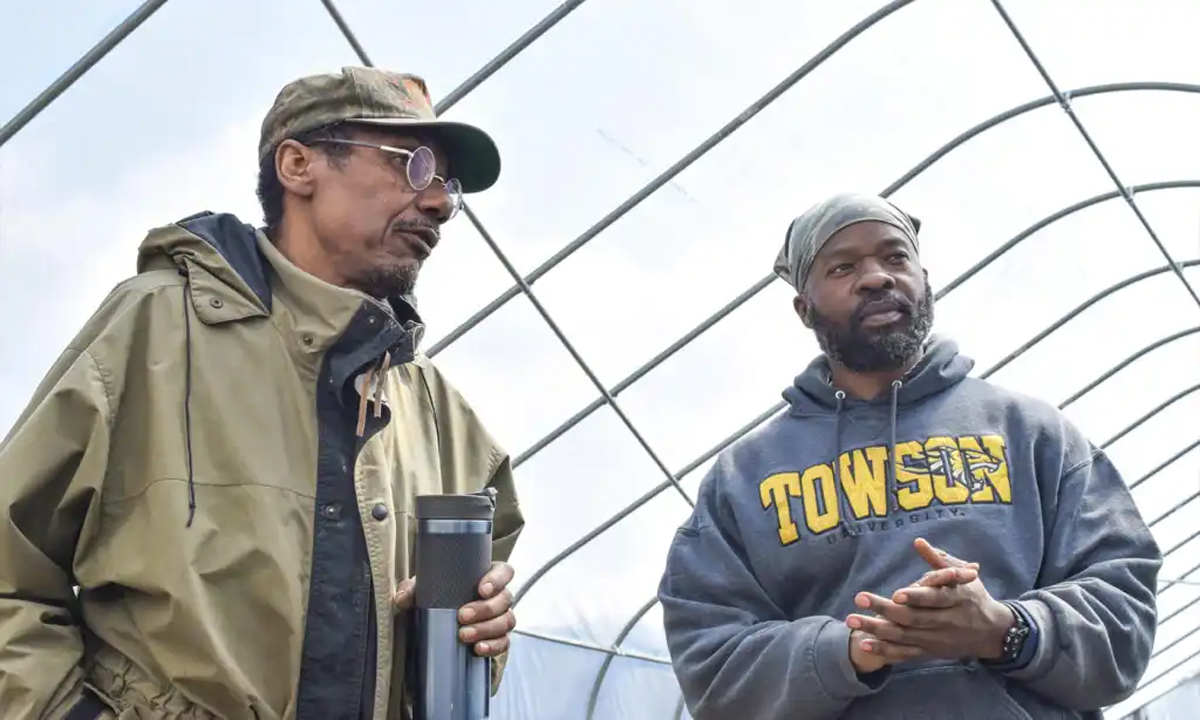 Veteran Farmers Jason Tartt and Sky Edwards inside one of the high tunnels they procured with the help of USDA NRCS. (Photo credit: Rebecca Haddix, USDA)