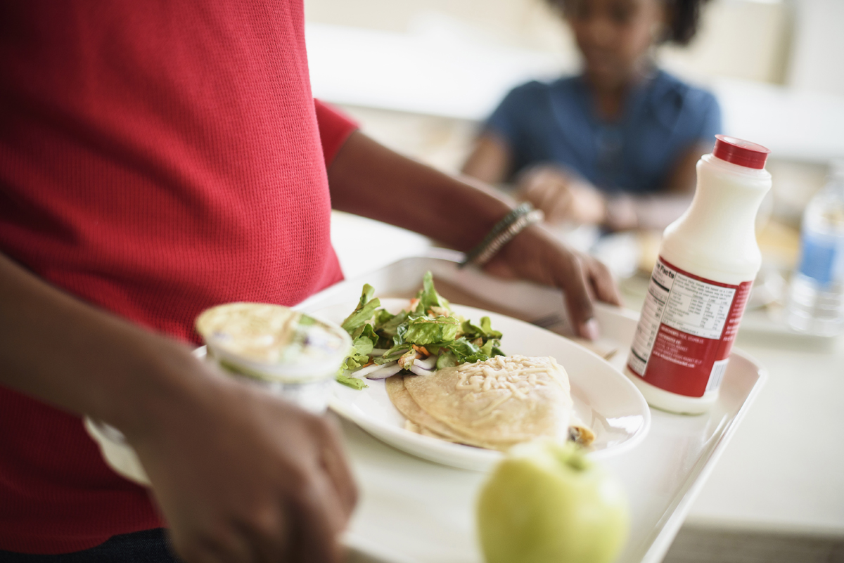 Students eating lunch in school cafeteria