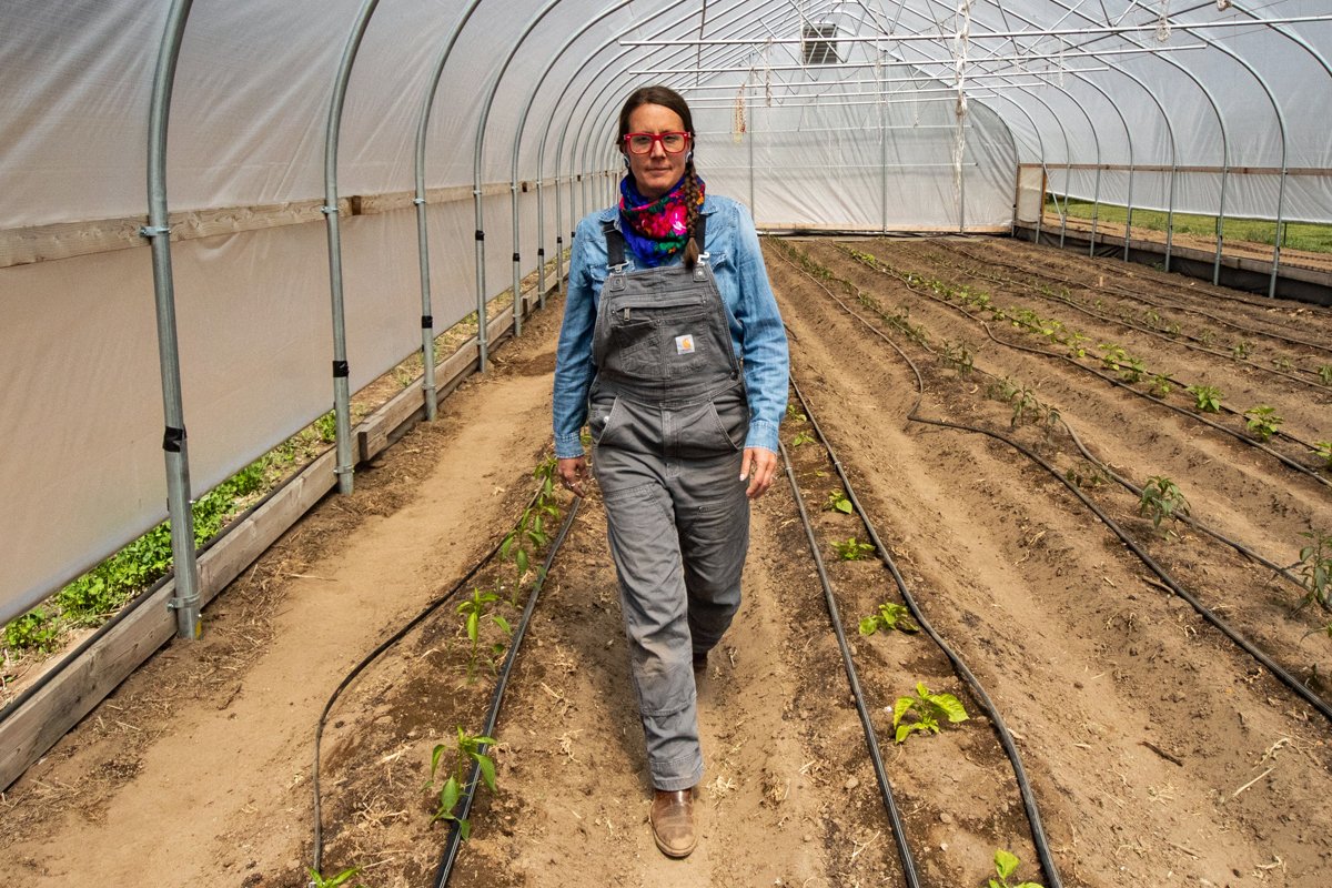 Spring Alaska Schreiner walks in her greenhouse at Sakari Farms. (Photo courtesy of Spring Alaska Schreiner)