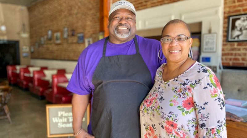 Leland, Miss., natives Lisa and Cedric Bush smile this month inside their newly opened restaurant, Bush’s Kountry Cafe, formerly the Leland Café. Over the past two years, restaurants have struggled to stay afloat, but some states have passed measures to help them survive. (Photo credit: Stateline, an initiative of The Pew Charitable Trusts)