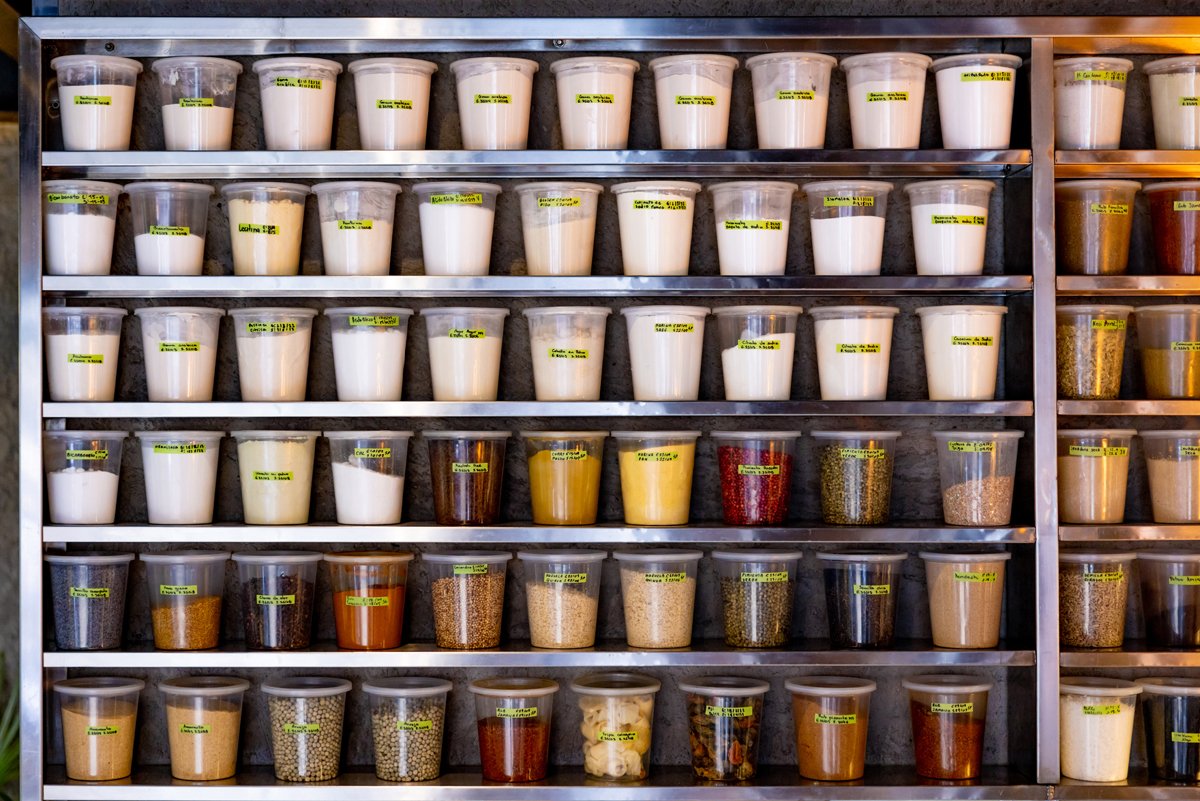 Pantry of spices in a commercial kitchen at a restaurant